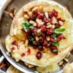 Baked Brie with Sun Dried Tomato and Pine Nuts